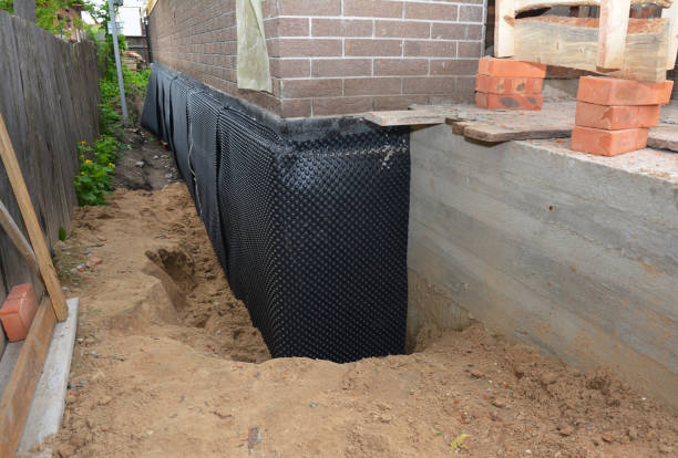 Happy homeowners after waterproofing job in Mogadore